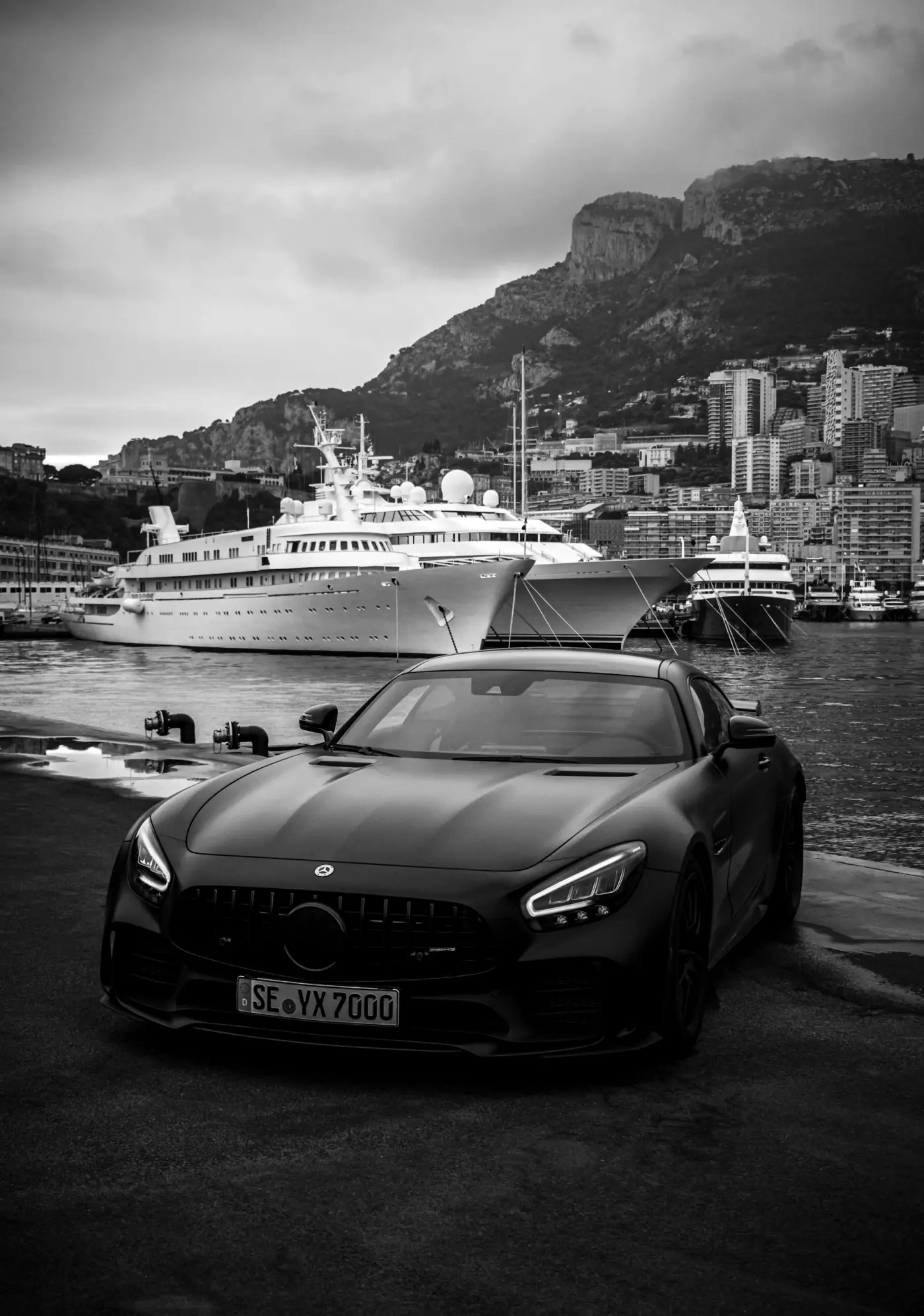A black sports car on the harbour quay in Monaco